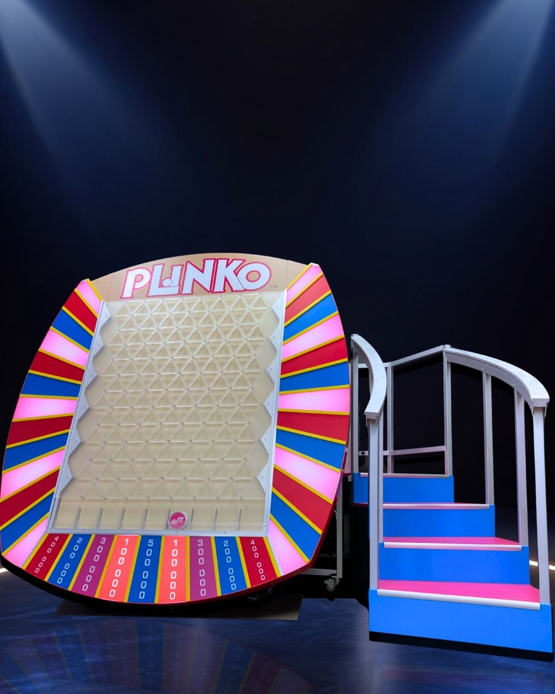 Plinko prize board with illuminated prize areas